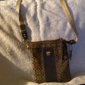 Coach shoulder purse. Long straps . Pockets on both out sides along with enough